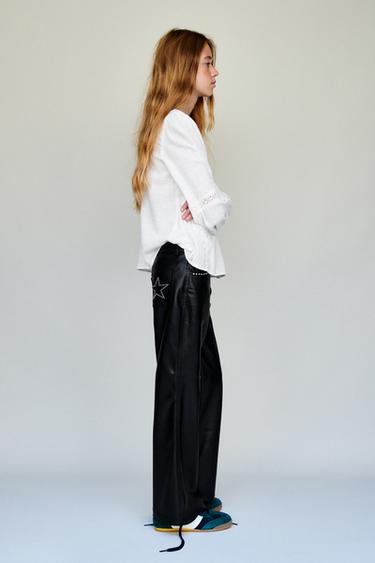 STUDDED LEATHER EFFECT FLARE TROUSERS - Black by Zara