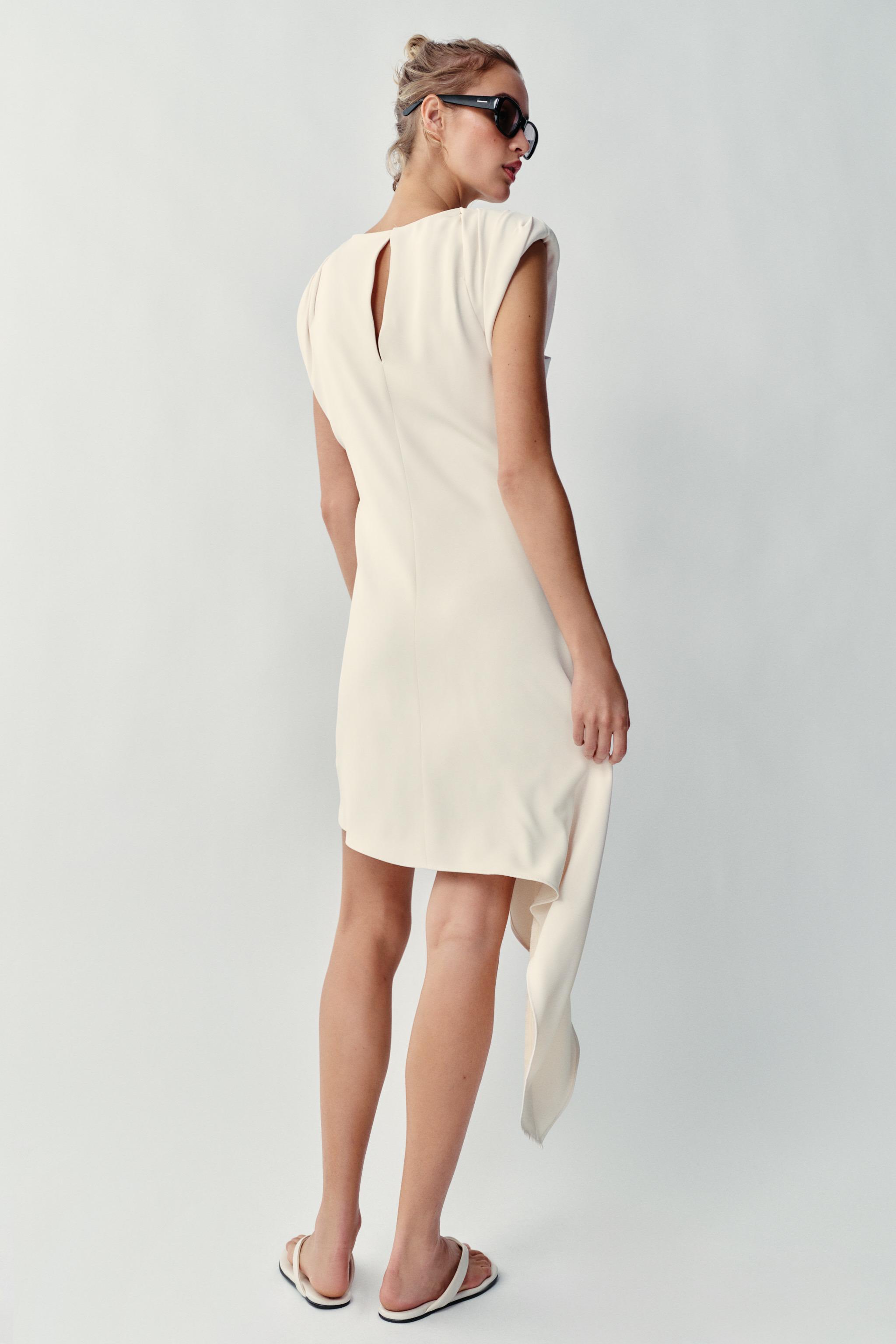 ASYMMETRIC SHORT DRESS WITH SHOULDER PADS
