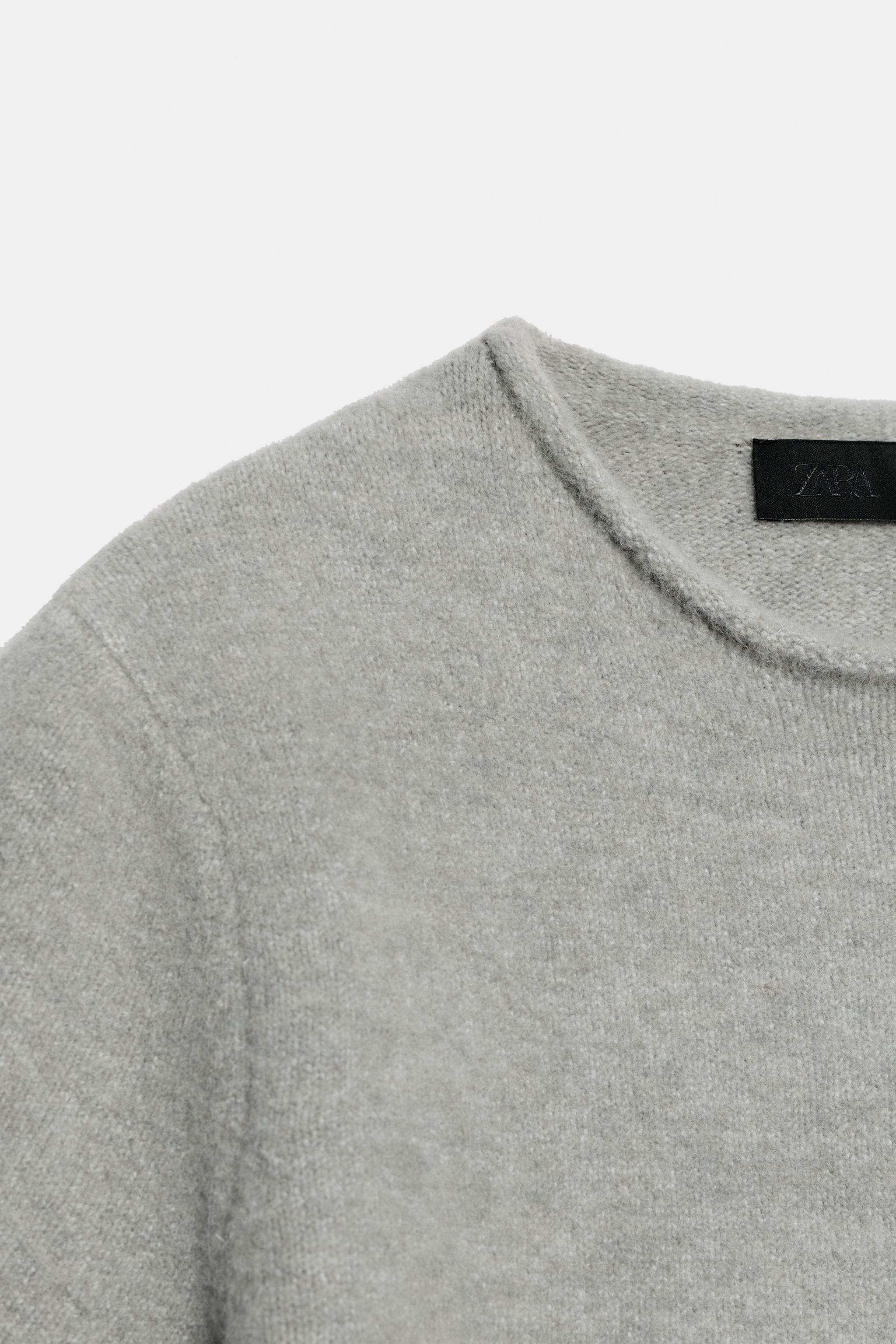 PULL EN MAILLE DOUCE À MANCHES COURTES