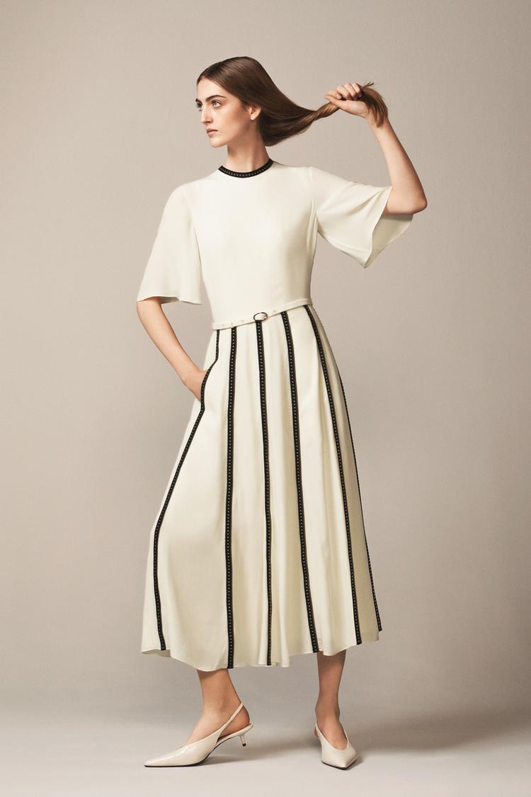 DRESS WITH CONTRASTING STRAPS AND STUDS - THE ITEM