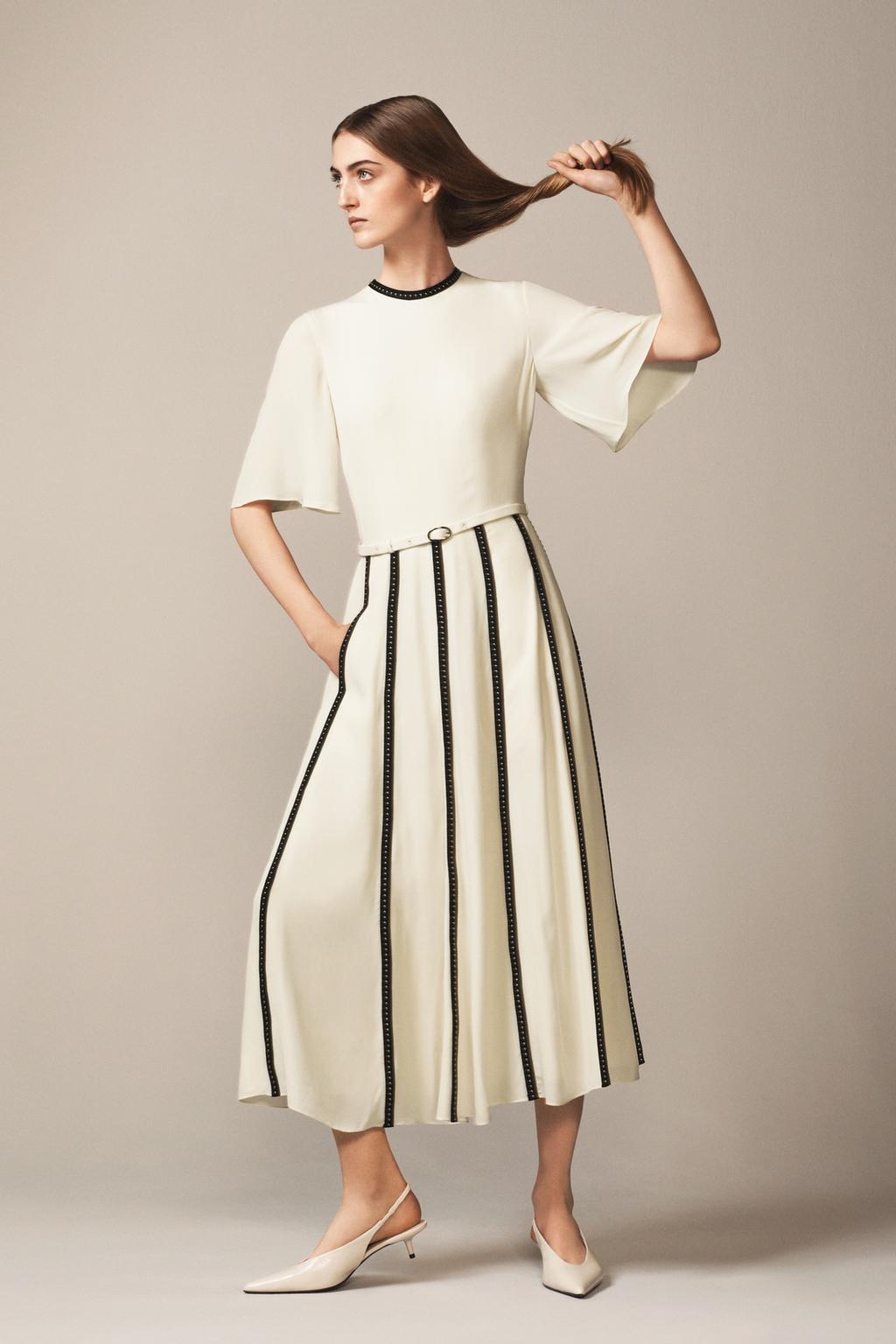 DRESS WITH CONTRASTING STRAPS AND STUDS - THE ITEM