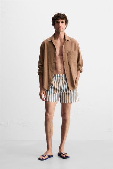 COSTUME DA BAGNO MEDIO A RIGHE - Celeste di Zara - Immagine 0