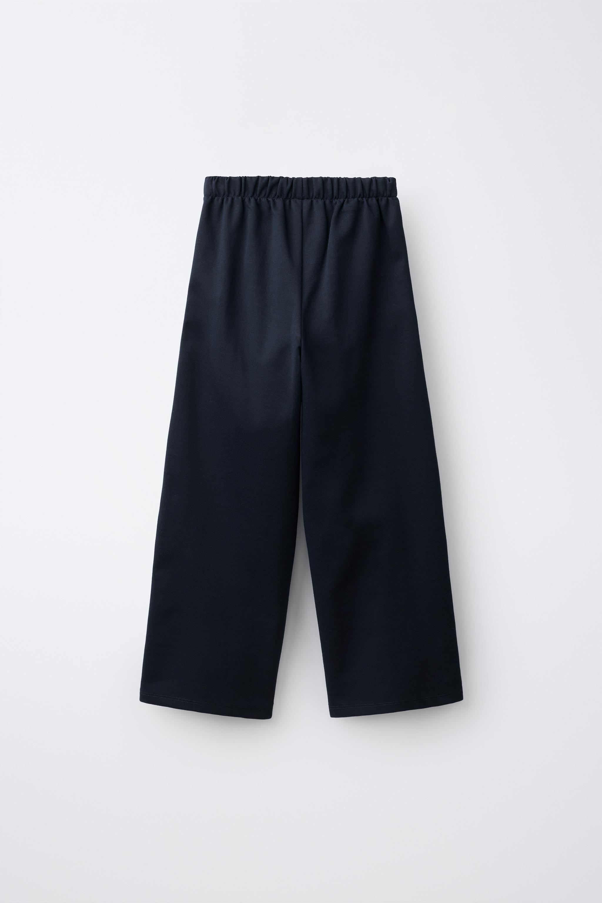 WIDE LEG PLEATED PANTS