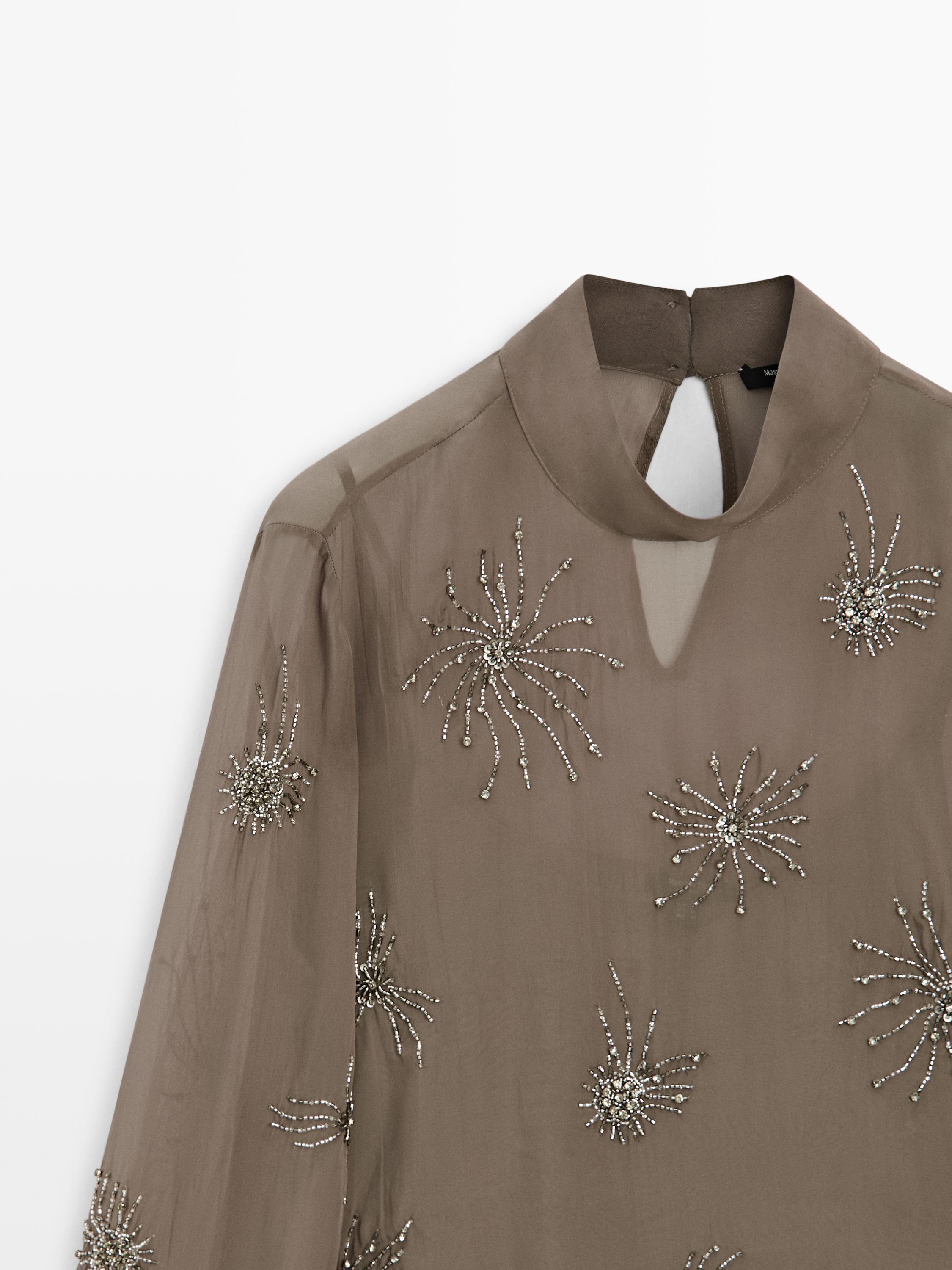 Embroidered semi-sheer blouse