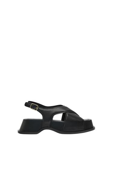 LEATHER SANDALS WITH CRISS-CROSS STRAPS