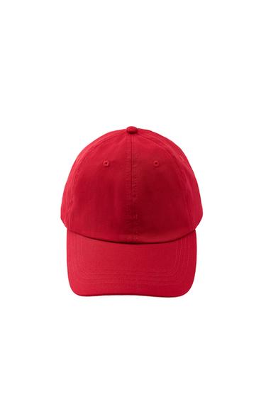 Front view of a red cap with a curved peak.