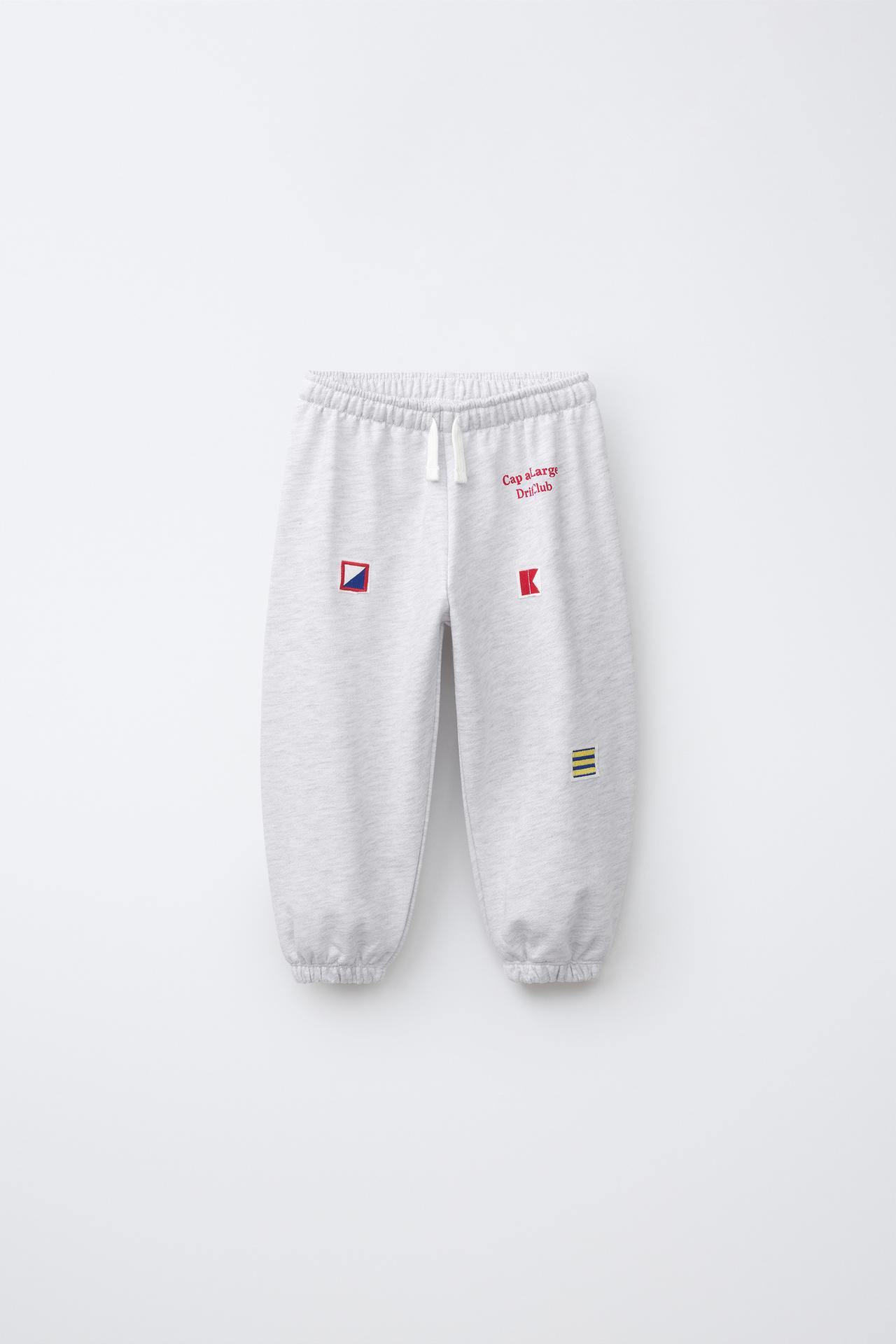 EMBROIDERED FLAG JOGGER PANTS — Gray marl