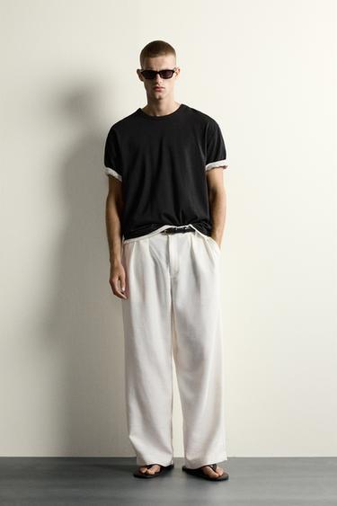 PANTALÓN RELAXED FIT ESTRUCTURA PLIEGUES - Blanco de Zara - Imagen 0