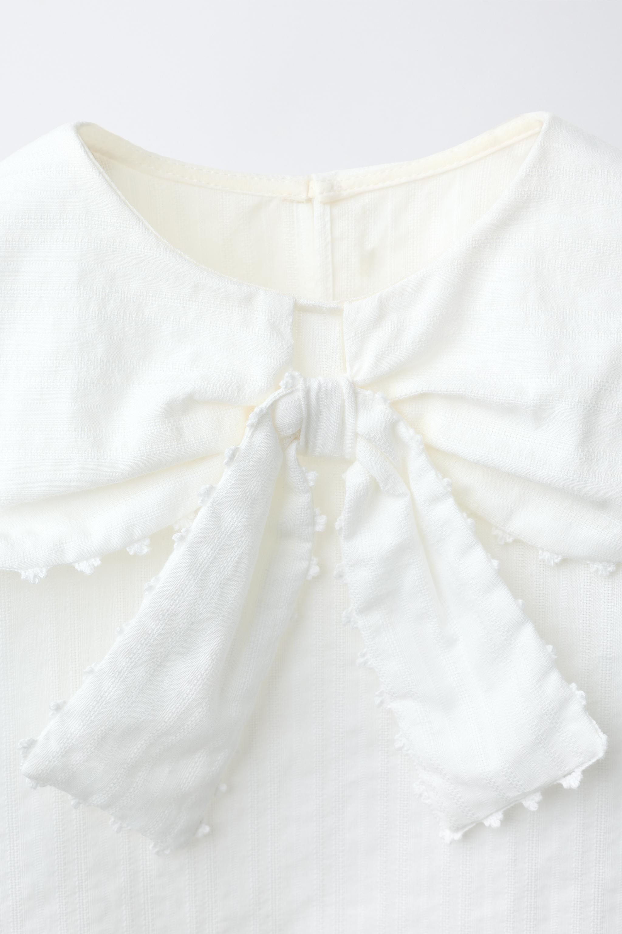 CHEMISE EN PLUMETIS À COL CLAUDINE