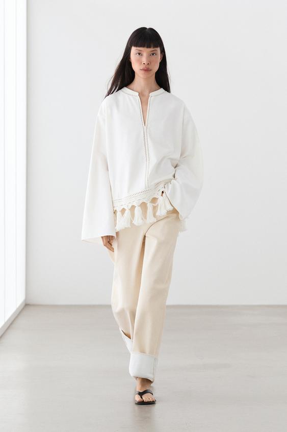 Embroidered blouse with fringed hem from Zara - $180