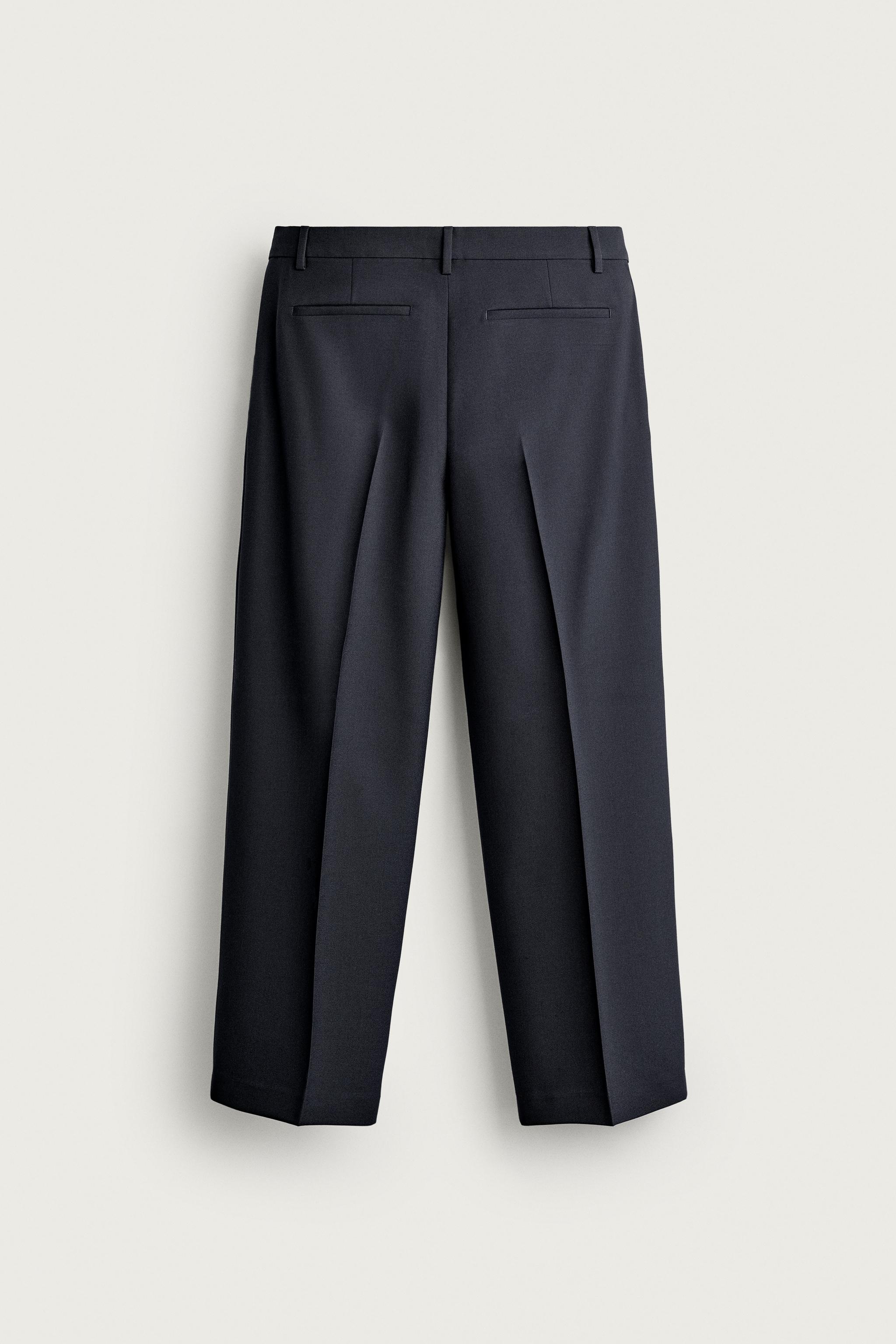 RELAXED FIT PLEATED PANTS