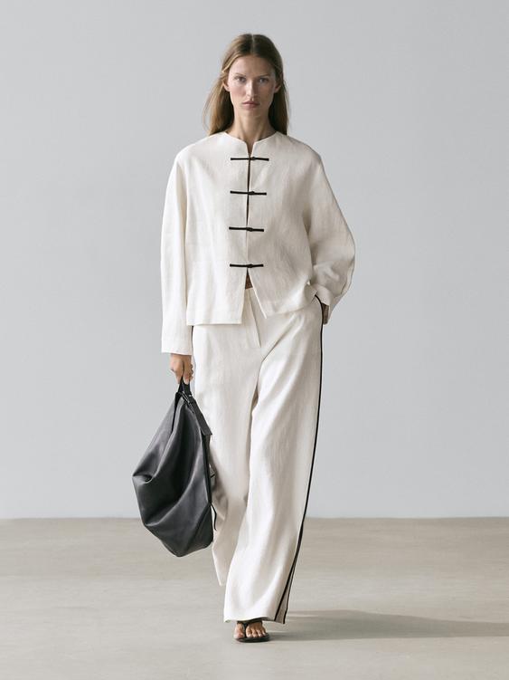 Linen trousers with contrast piping