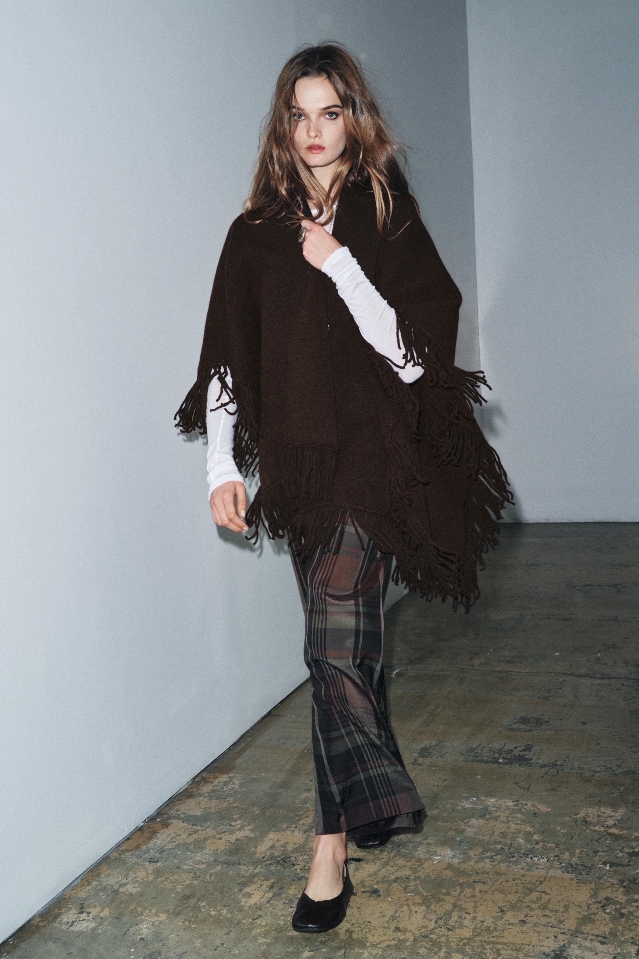 FRINGED KNIT CAPE