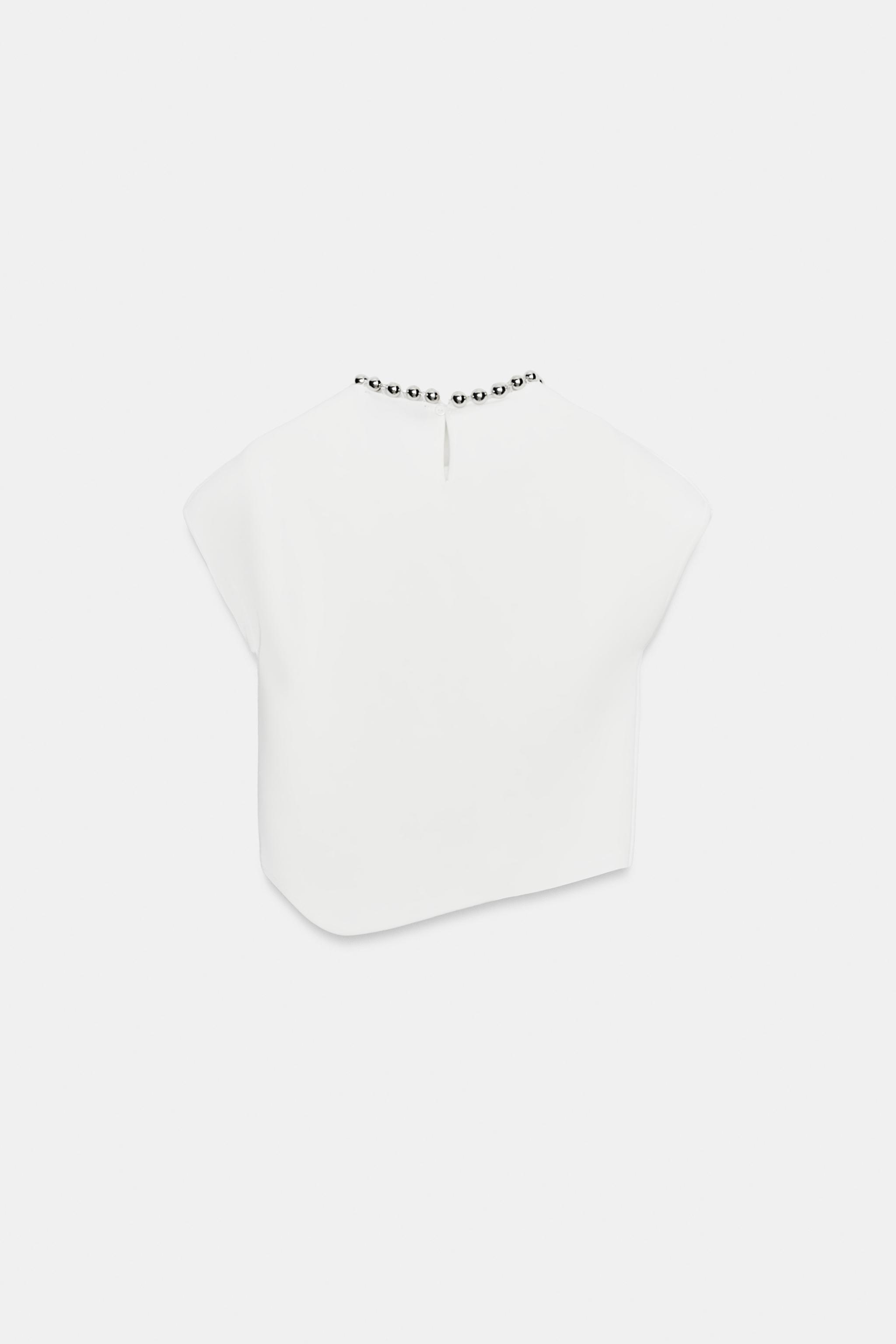 TOP EN MAILLE À BOULES AU COL