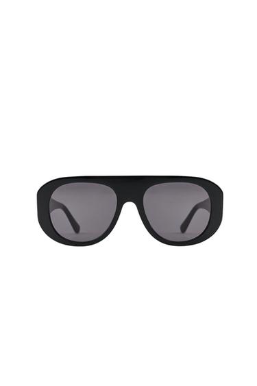 Front view of black shield-style sunglasses with polarised lenses and UV/UVA 400 protection.