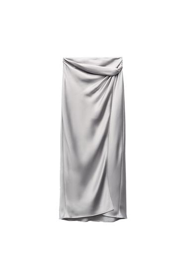 Satin grey skirt with a draped design on the top, on a white background.