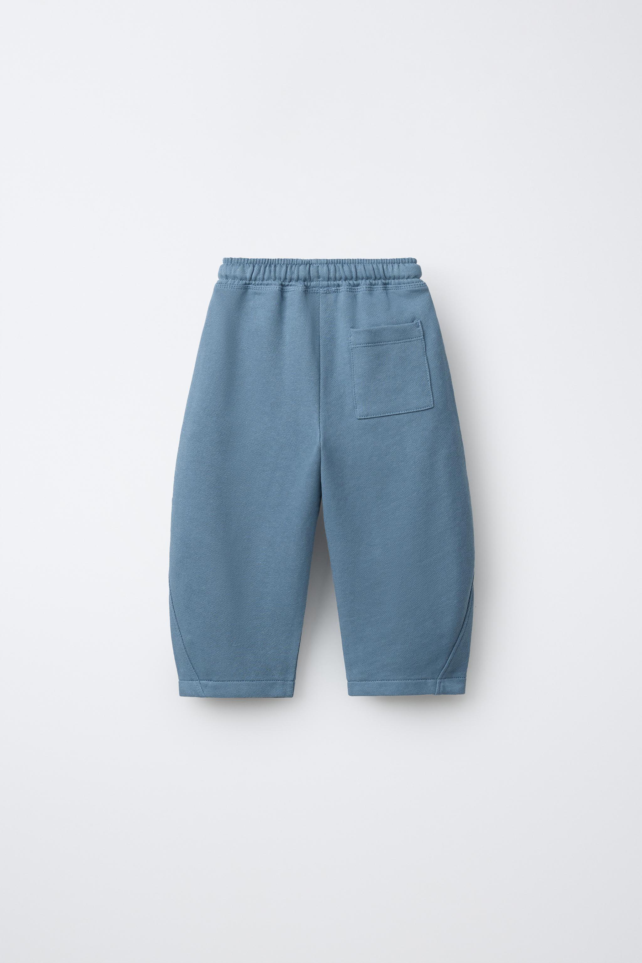 PANTALON BARREL EN MOLLETON AVEC ÉTIQUETTE