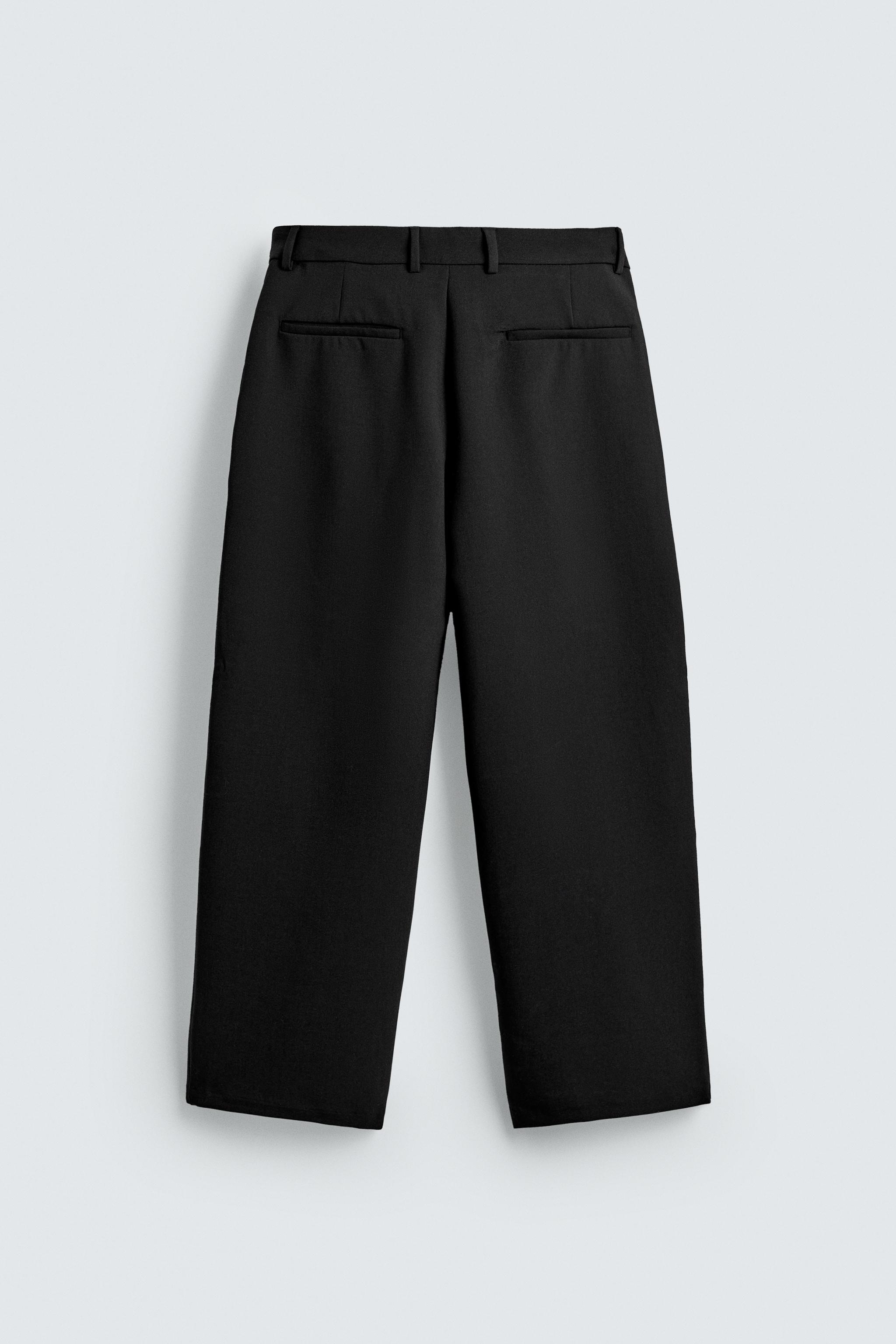 RELAXED FIT PLEATED PANTS
