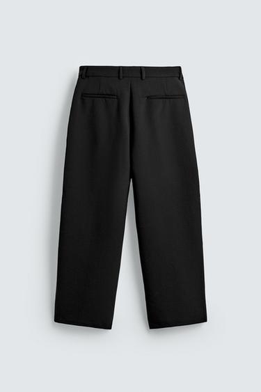 PANTALONS RELAXED FIT AMB PLECS - Negre de Zara