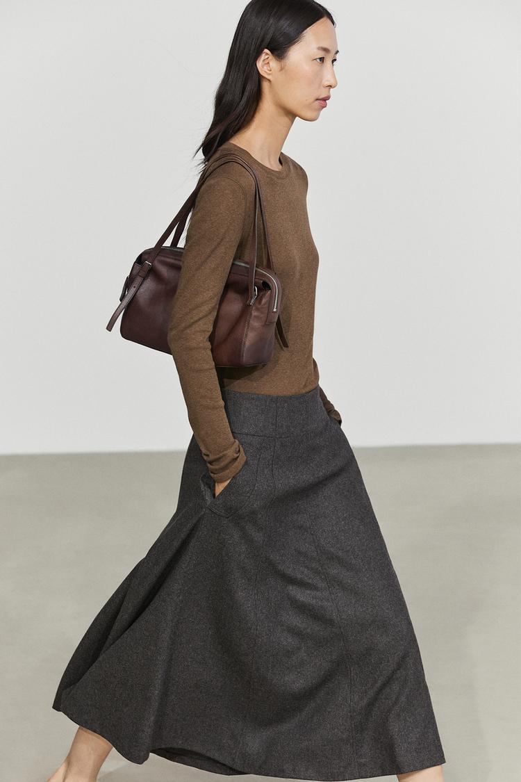 Flared midi skirt with pocket detail — 210