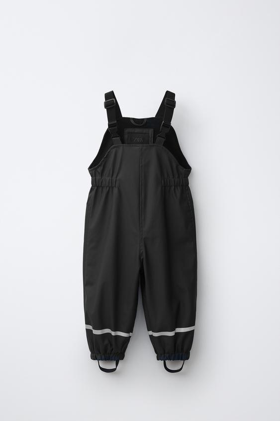 WATER-RESISTANT RUBBERISED JUMPSUIT - Black by Zara - Image 0