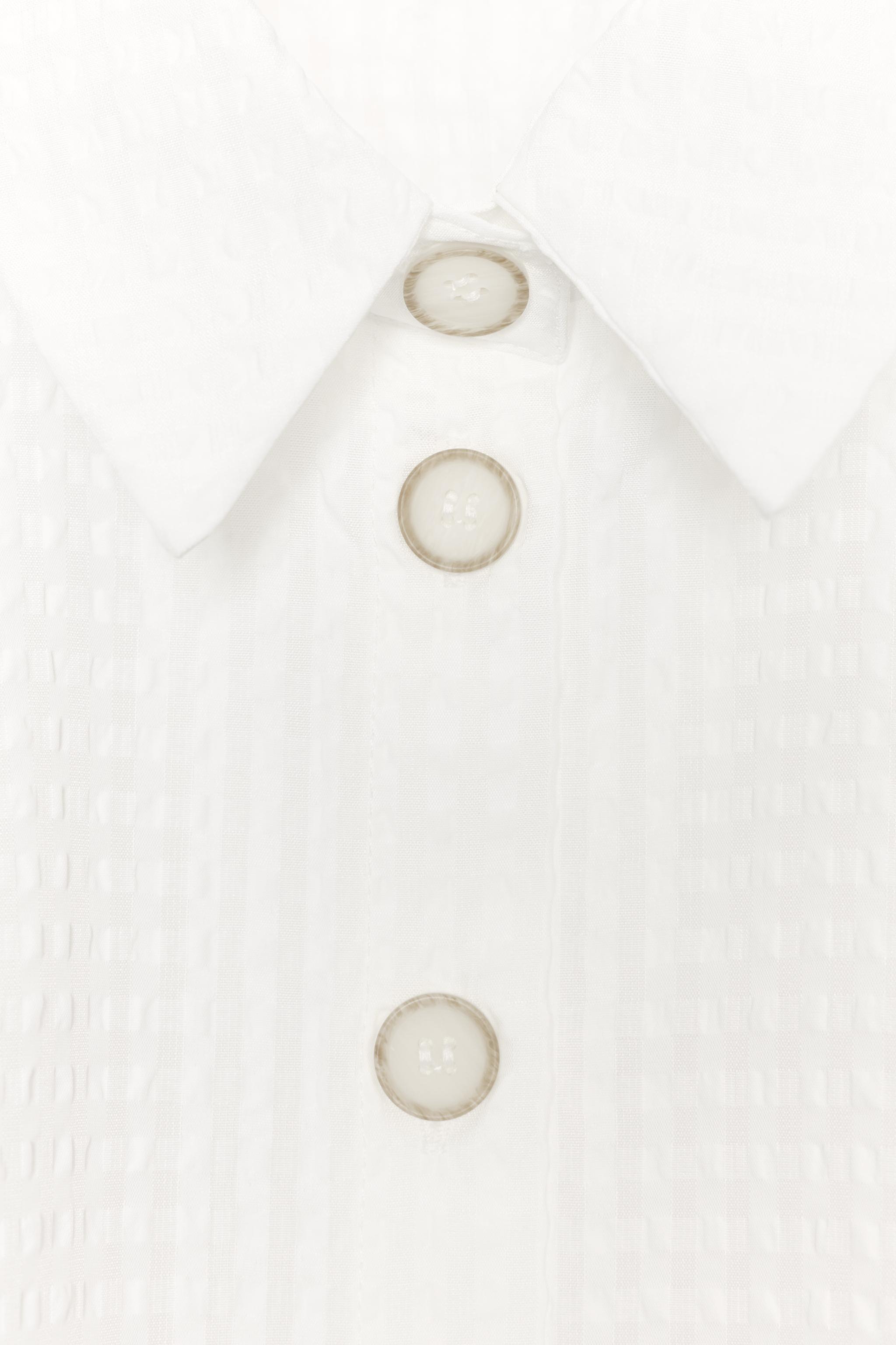 CHEMISE À MANCHES BOUFFANTES