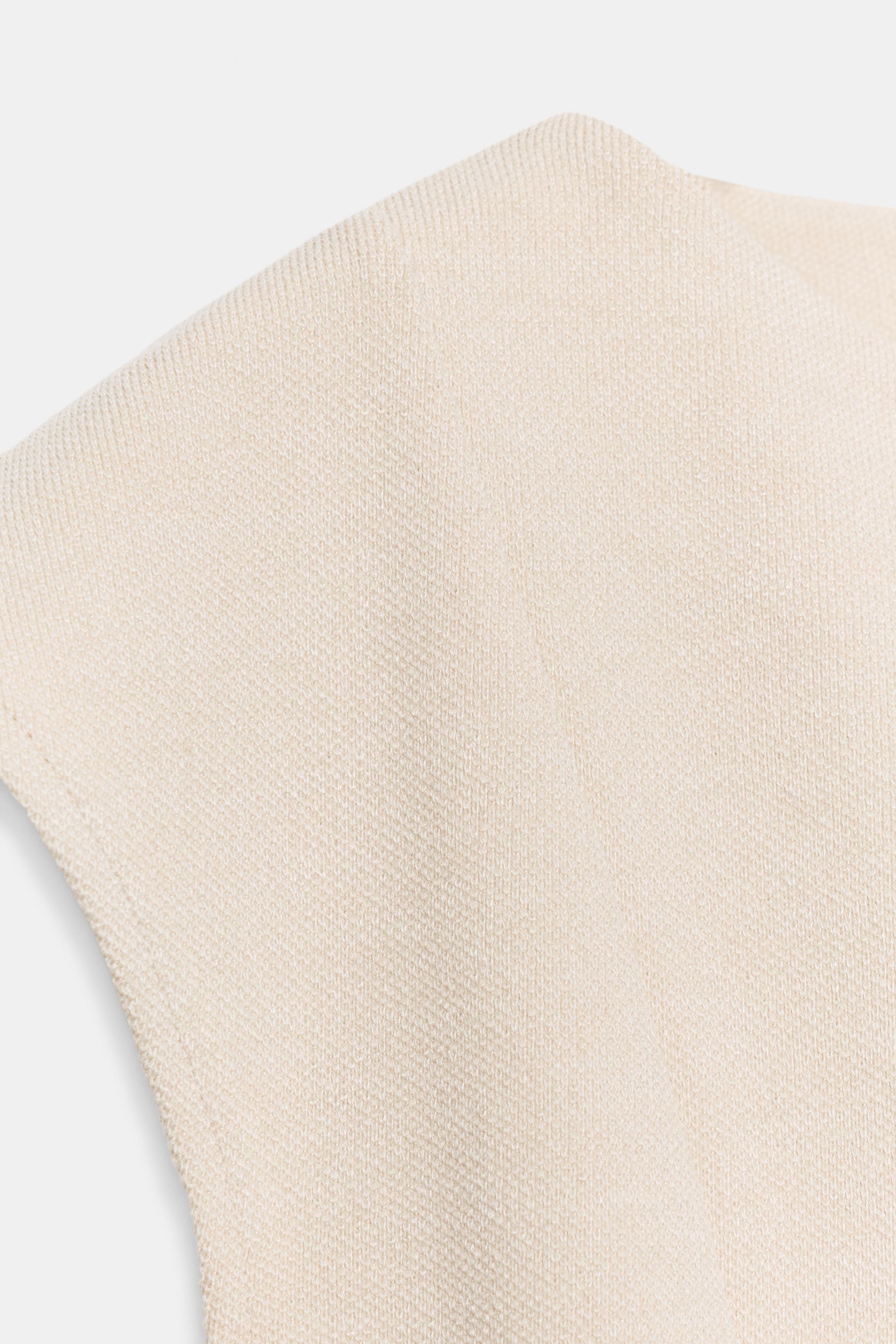 SHORT SLEEVE PIQUÉ PEPLUM TOP