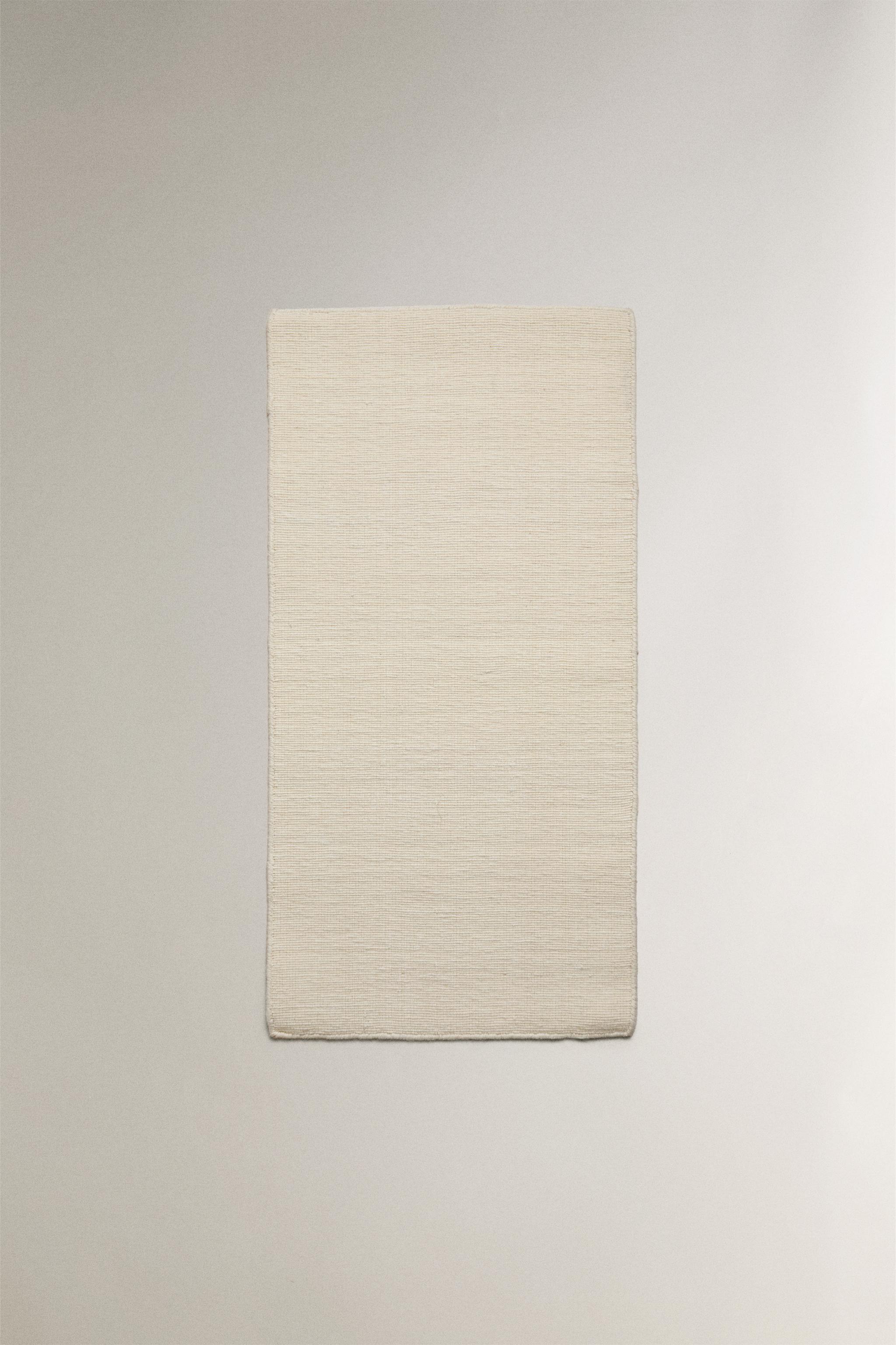WOOL AREA RUG WITH SCALLOPED LINES