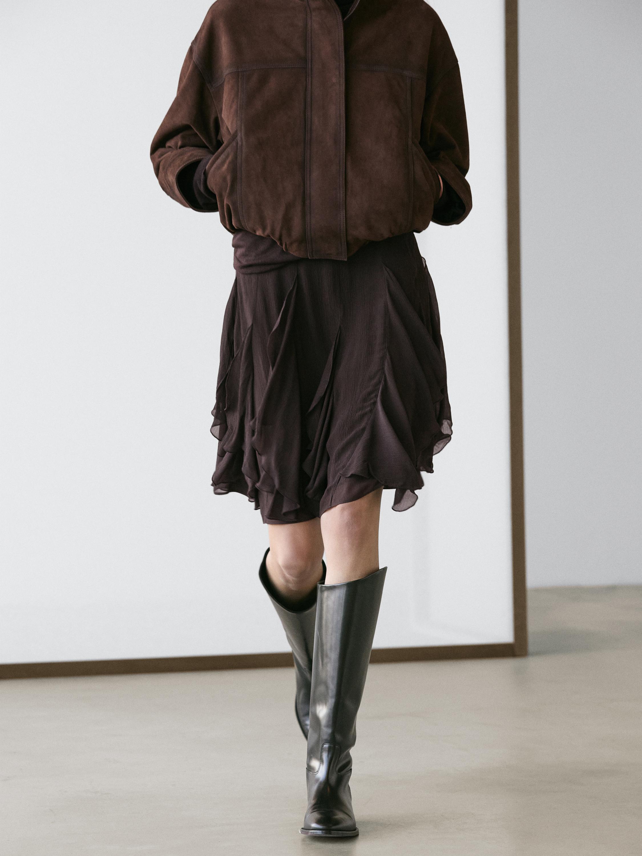 Asymmetric skirt with ruffles