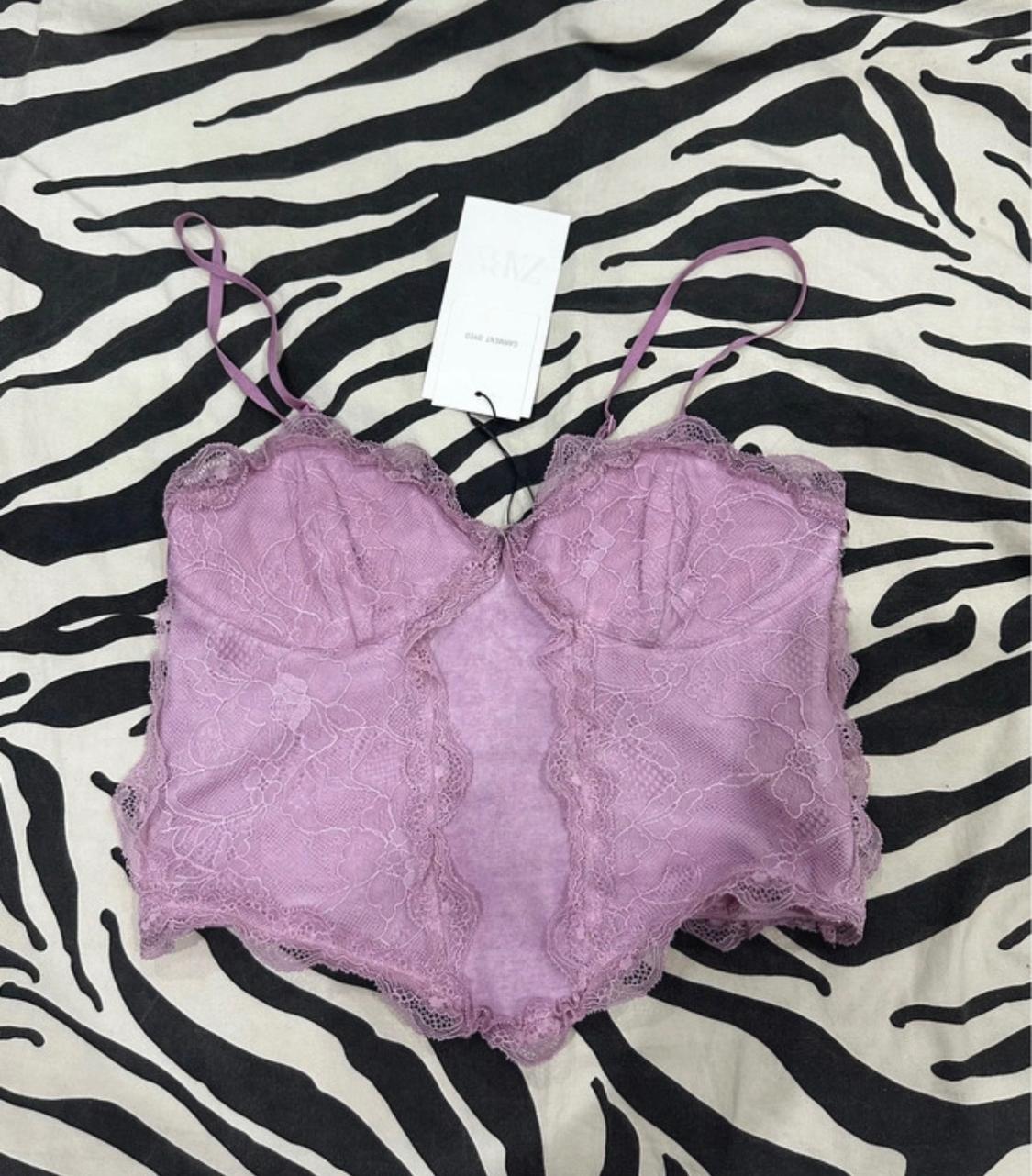 Lilac lace slip top with thin straps over zebra-print fabric. Label with the text ZARA GARMENT DYED.