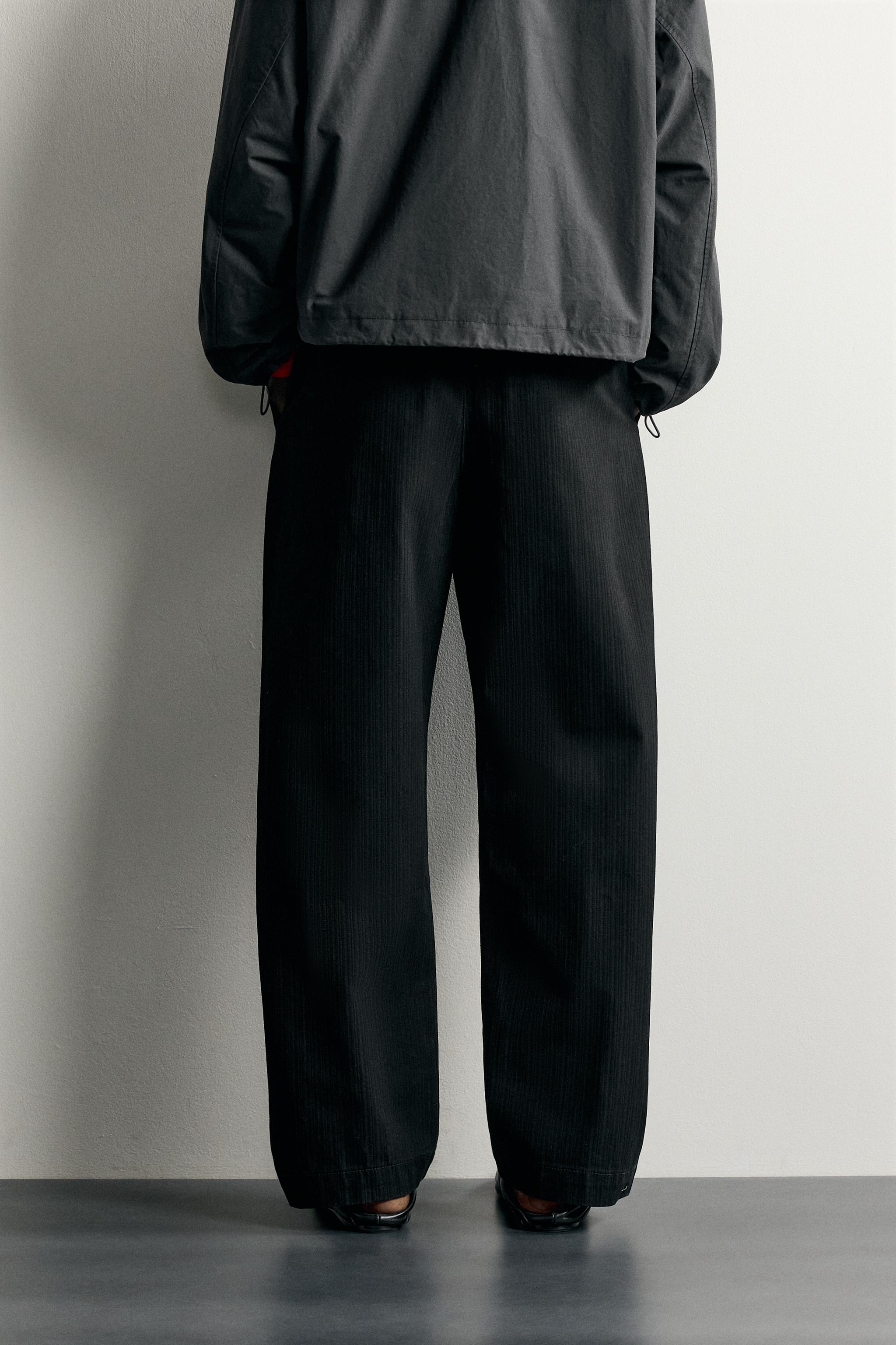 RELAXED FIT PLEATED CHINO PANTS
