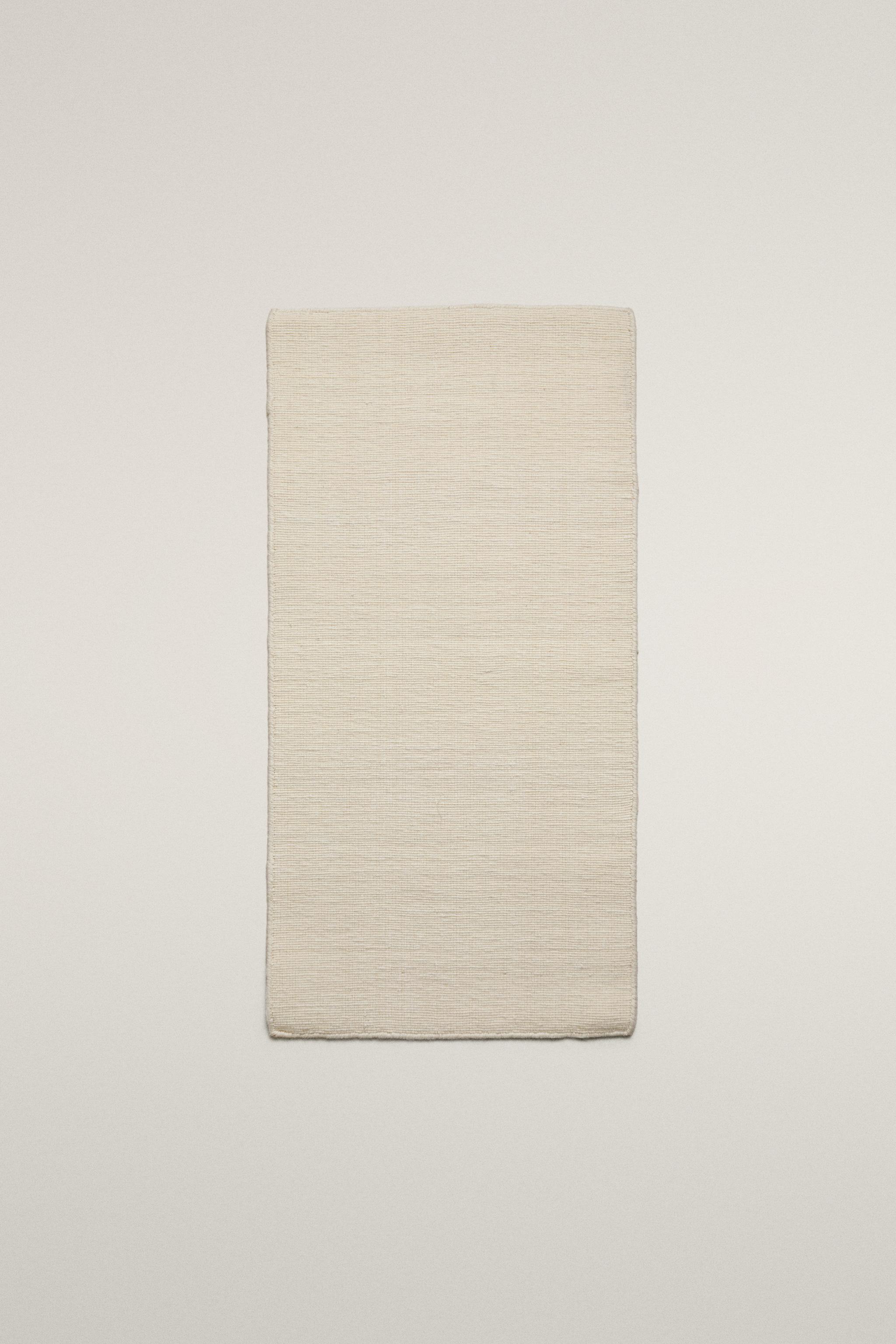 WOOL AREA RUG WITH SCALLOPED LINES