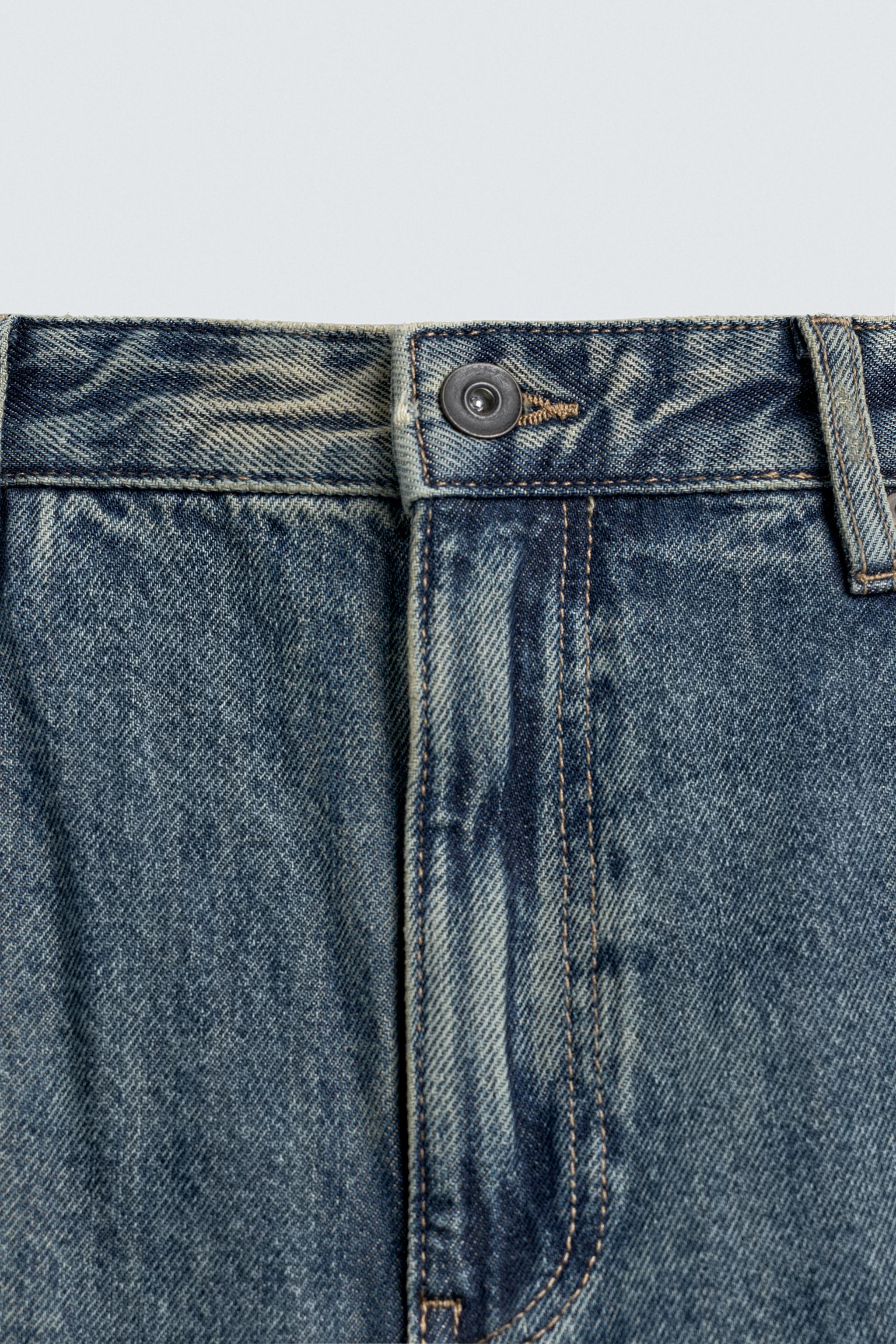 JEAN FLARE FIT DÉLAVÉ TACHES
