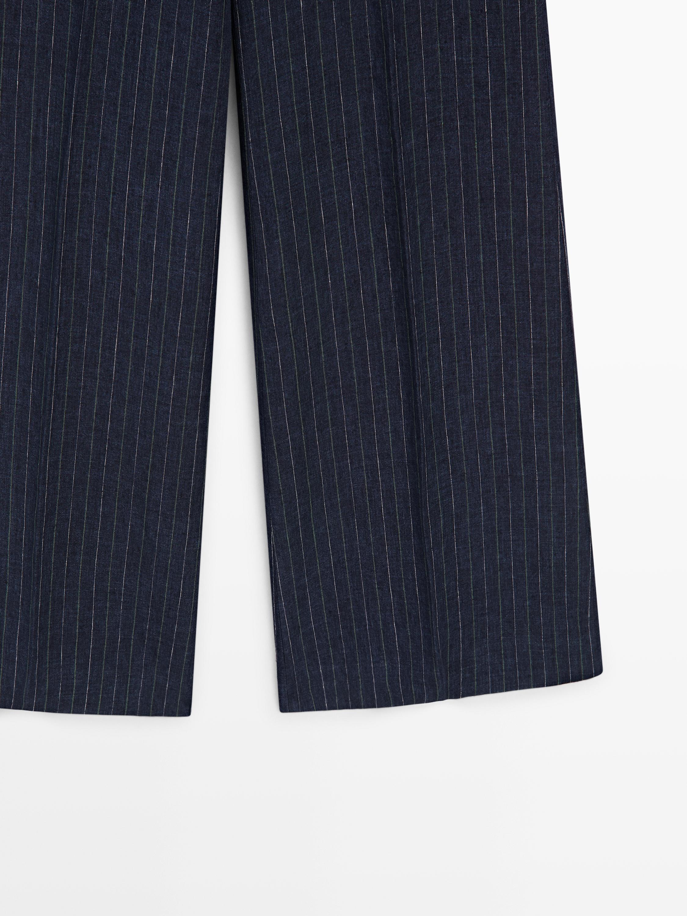 Flare fit linen trousers with striped details
