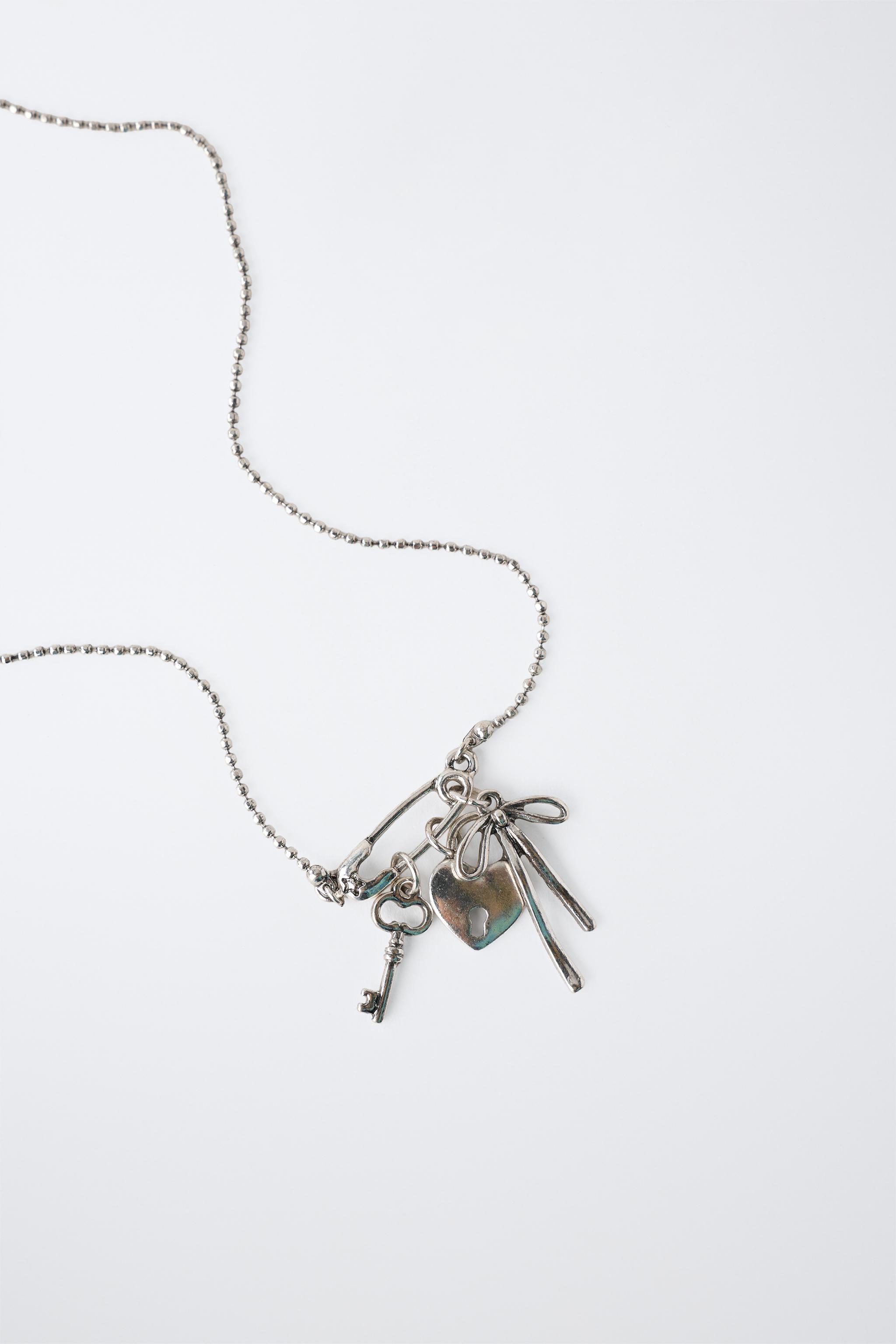 KEY, BOW, AND PADLOCK CHARM NECKLACE — Silver