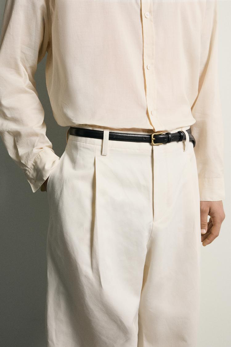 RELAXED FIT PLEATED TROUSERS
