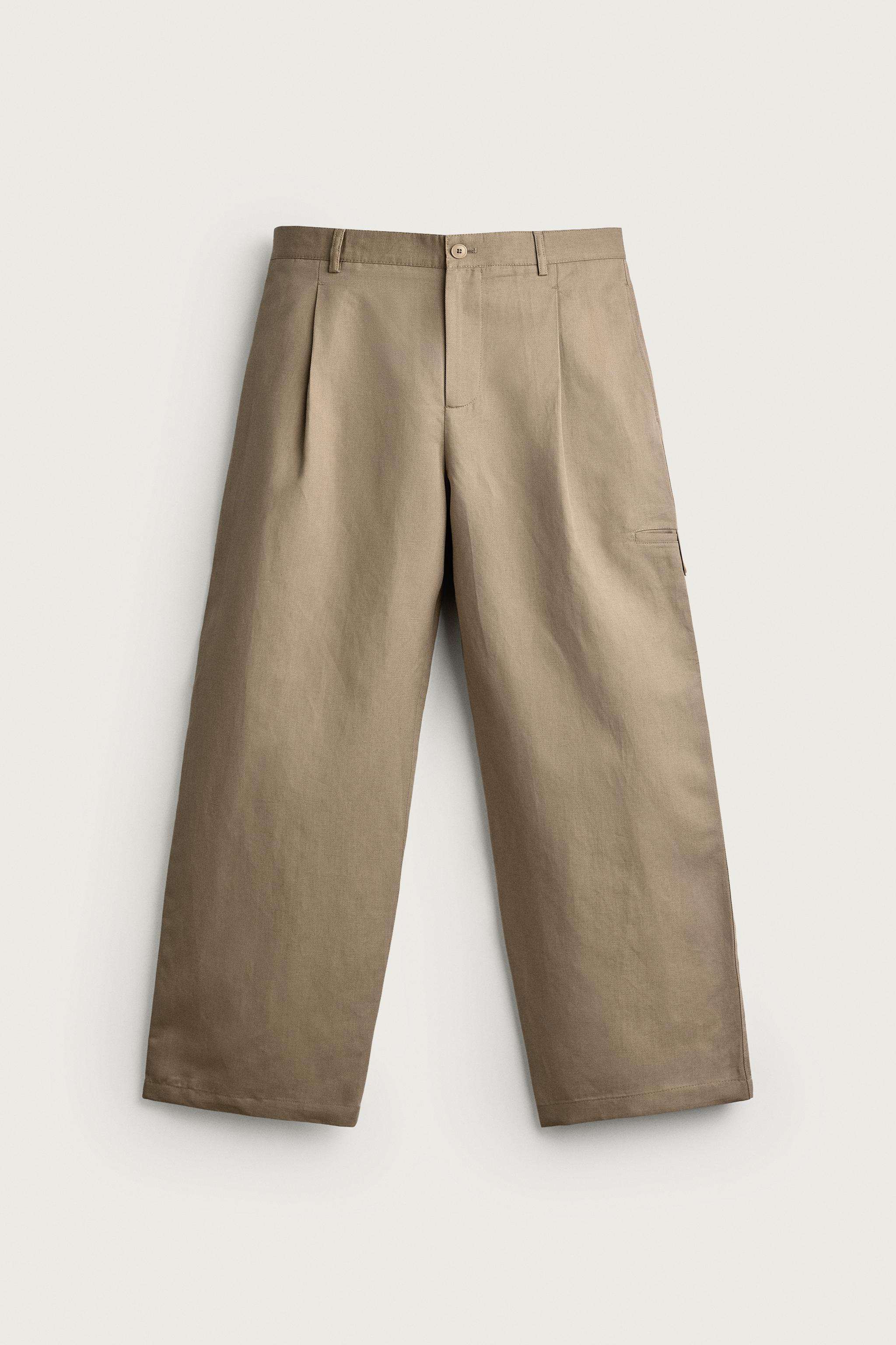 RELAXED FIT PLEATED PANTS — Beige