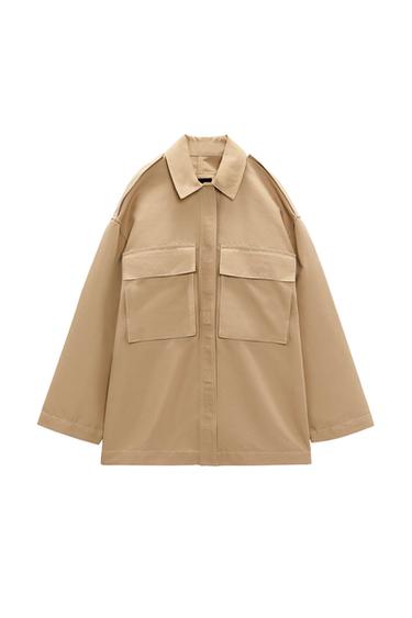 Front view of a beige jacket with large front pockets and a classic collar.