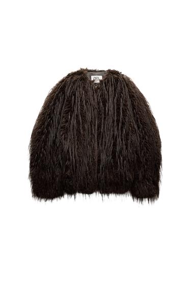 Front view of a dark brown fur coat with a visible label on the collar.