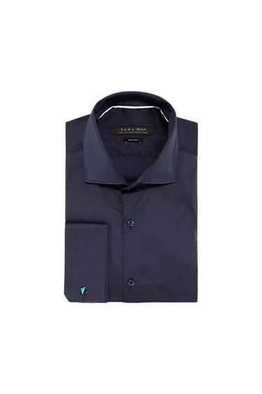 Men's navy blue shirt, Zara Man brand, with French cuffs and decorative cufflink. Visible interior tag with text "SLIM FIT".
