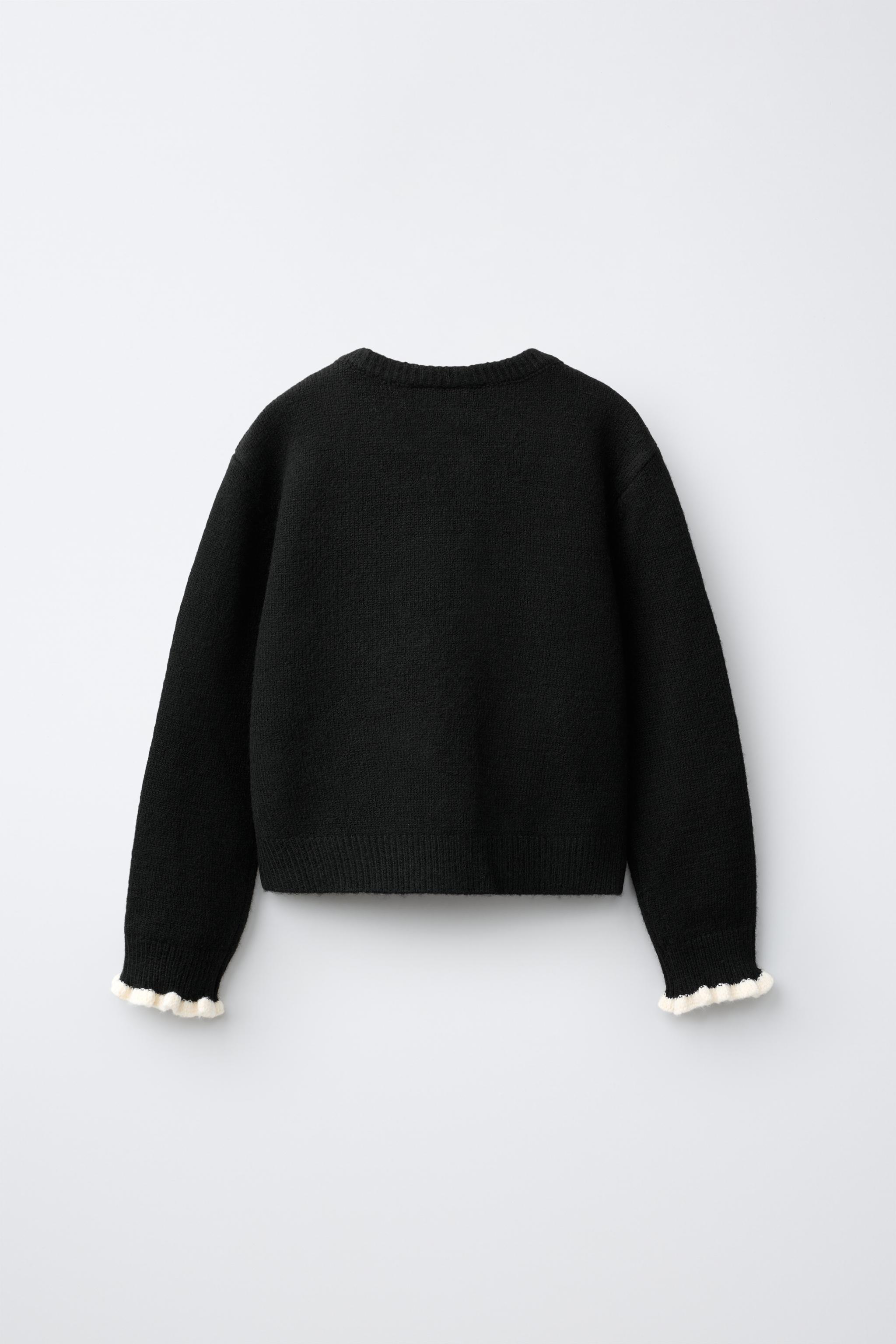 GILET EN MAILLE À VOLANTS CONTRASTANTS