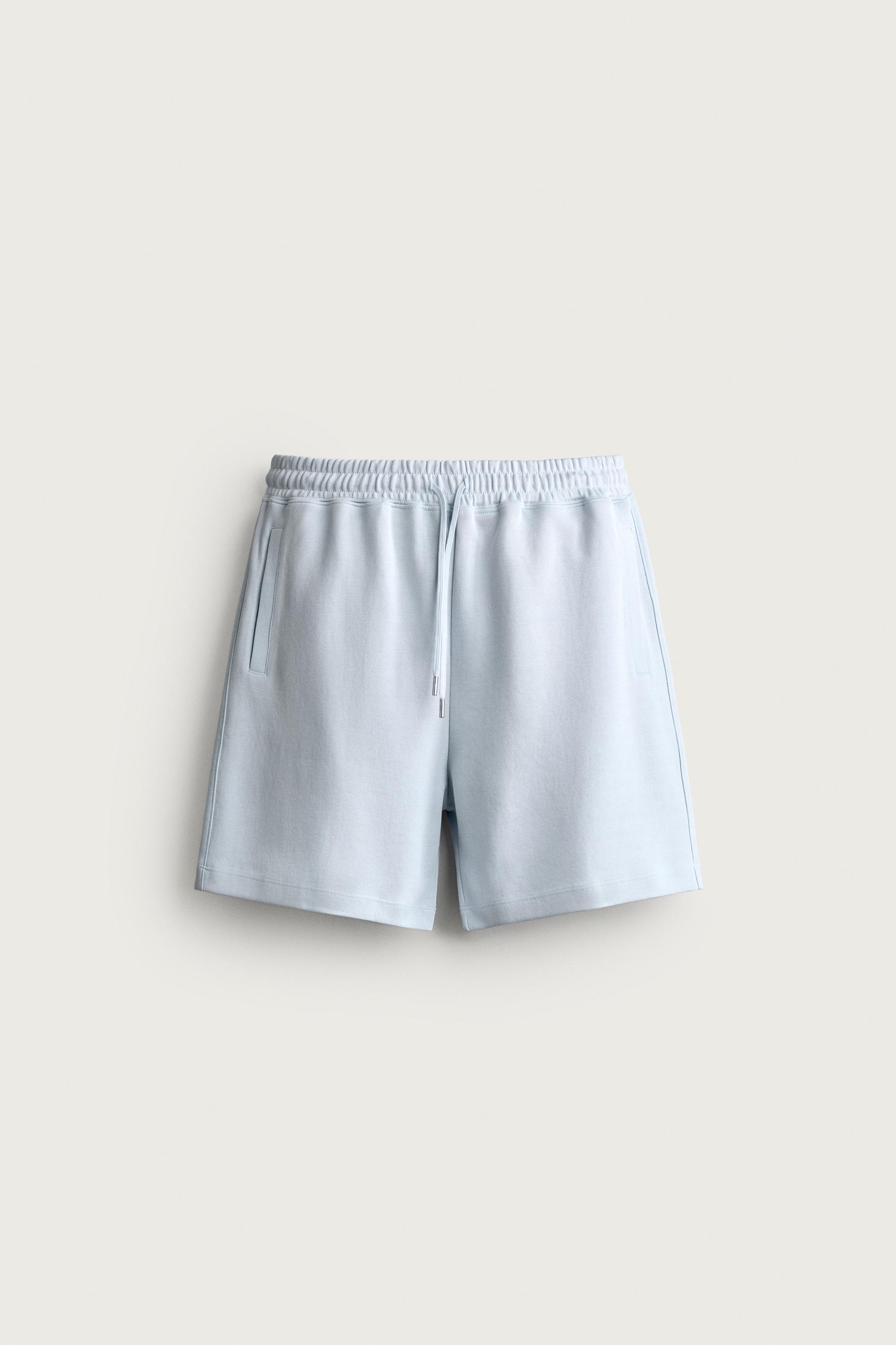 RELAXED FIT INTERLOCK TRACK SHORTS — Sky blue