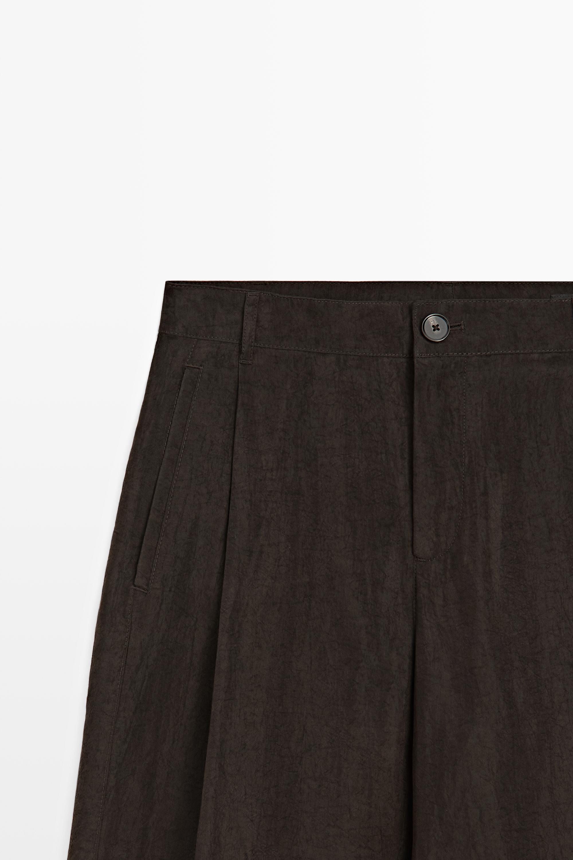 Wide-leg flowing trousers with darts