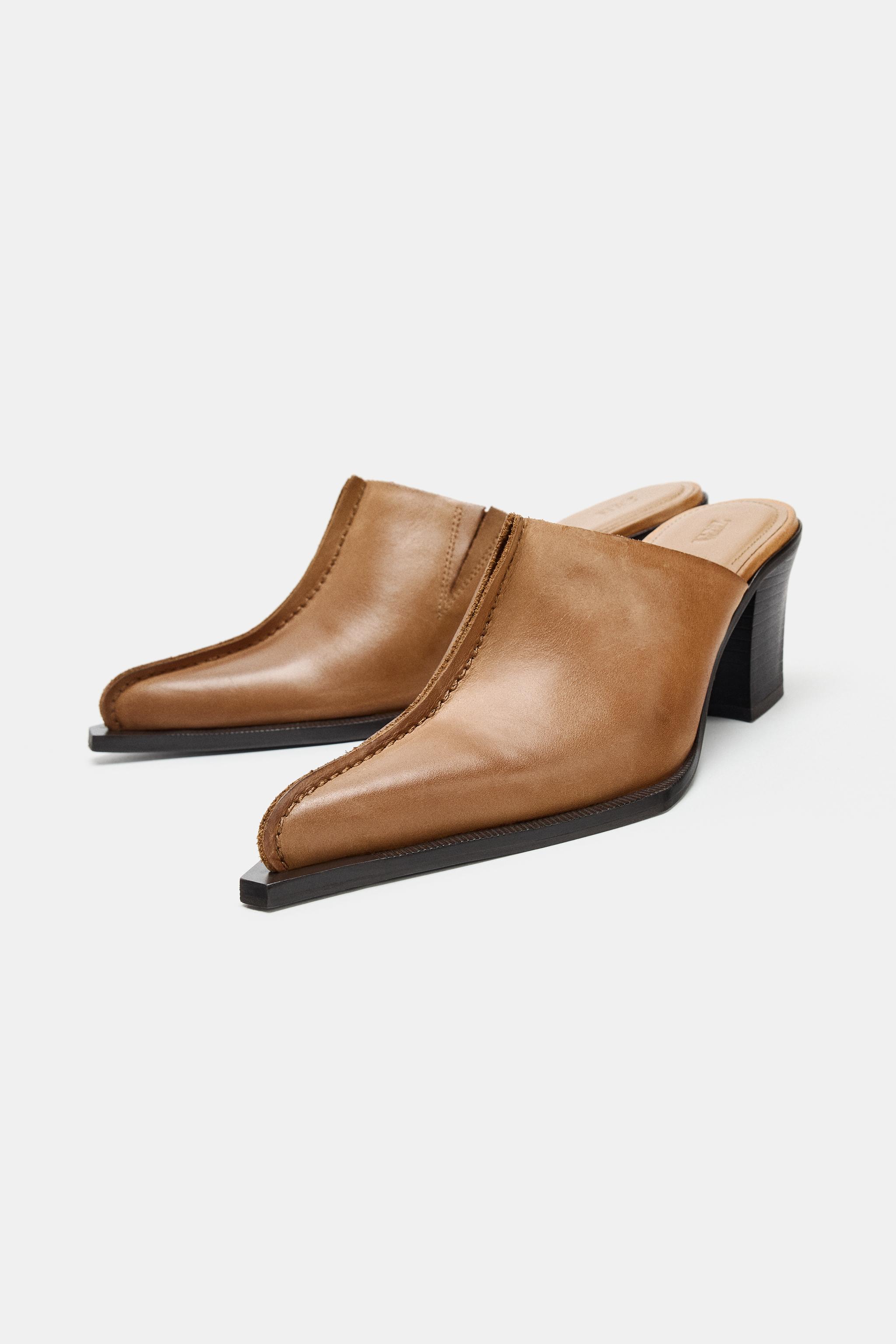 SABOTS EN CUIR AVEC SURPIQÛRE