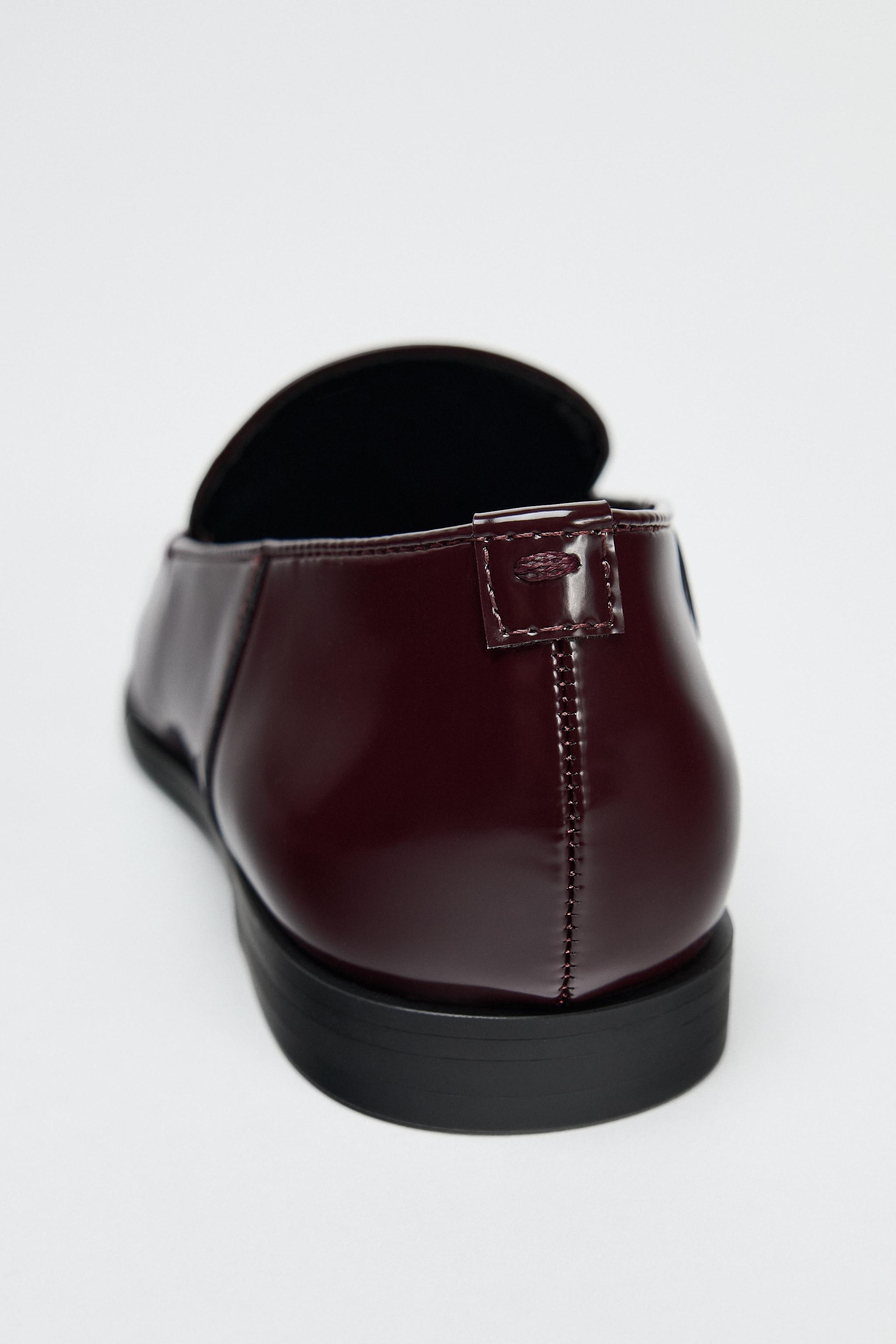 MOCASSINS À HOUPPE RELEVÉE