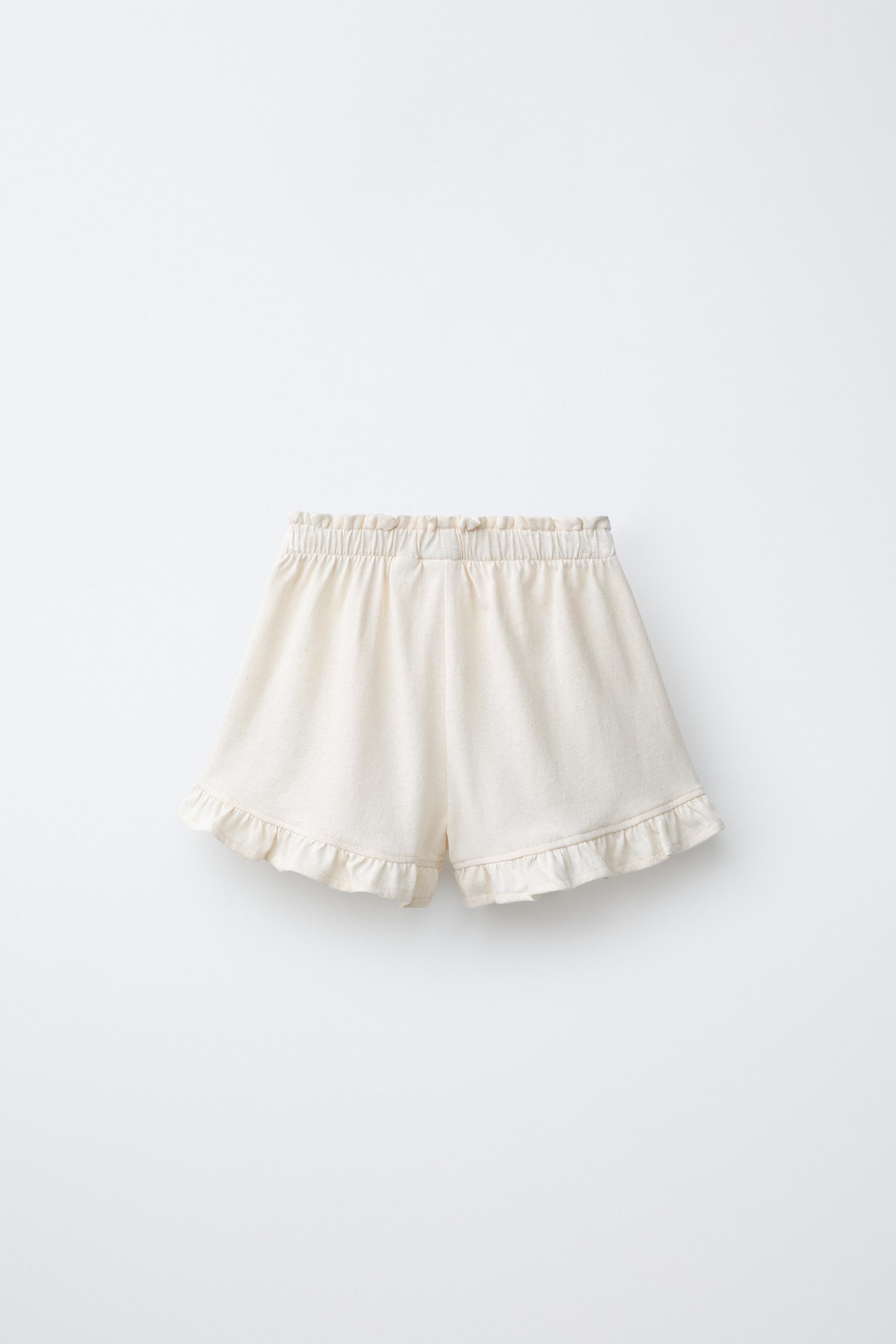 TROPICAL PRINT RUFFLE HEM SHORTS