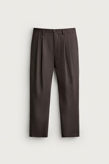 PANTALONS JACQUARD GEOMÈTRIC AMB PLECS - Marró de Zara