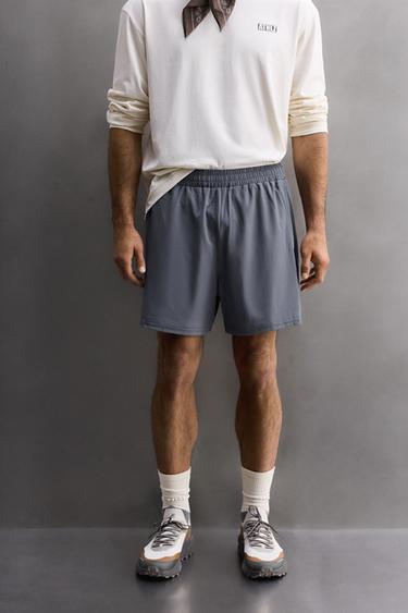 COMBINED PERFORATED SHORTS - Light blue by Zara