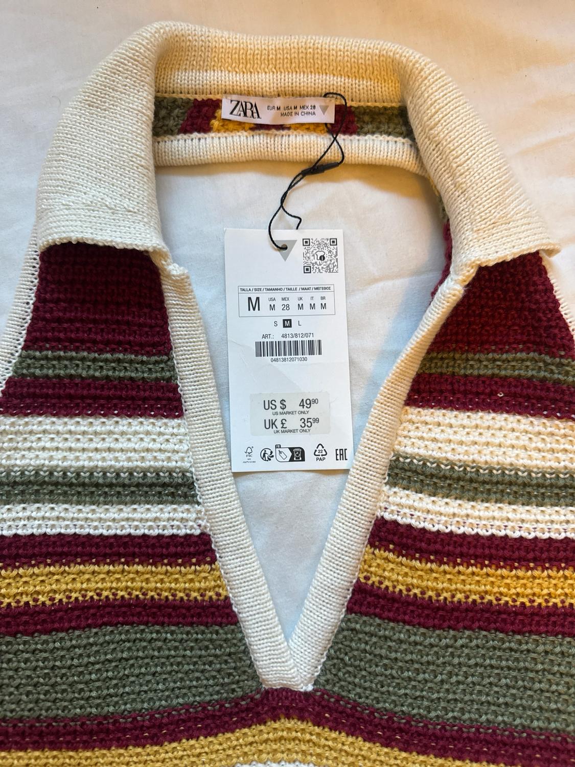 V-neck knitted striped top. Text: ZARA EUR M USA M MEX 28 MADE IN CHINA US $ 49.90 US MARKET ONLY UK £ 35.99.