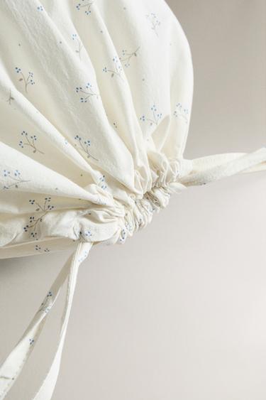 BOLSA GUARDA ROPA INFANTIL FLOR - Mantequilla de Zara